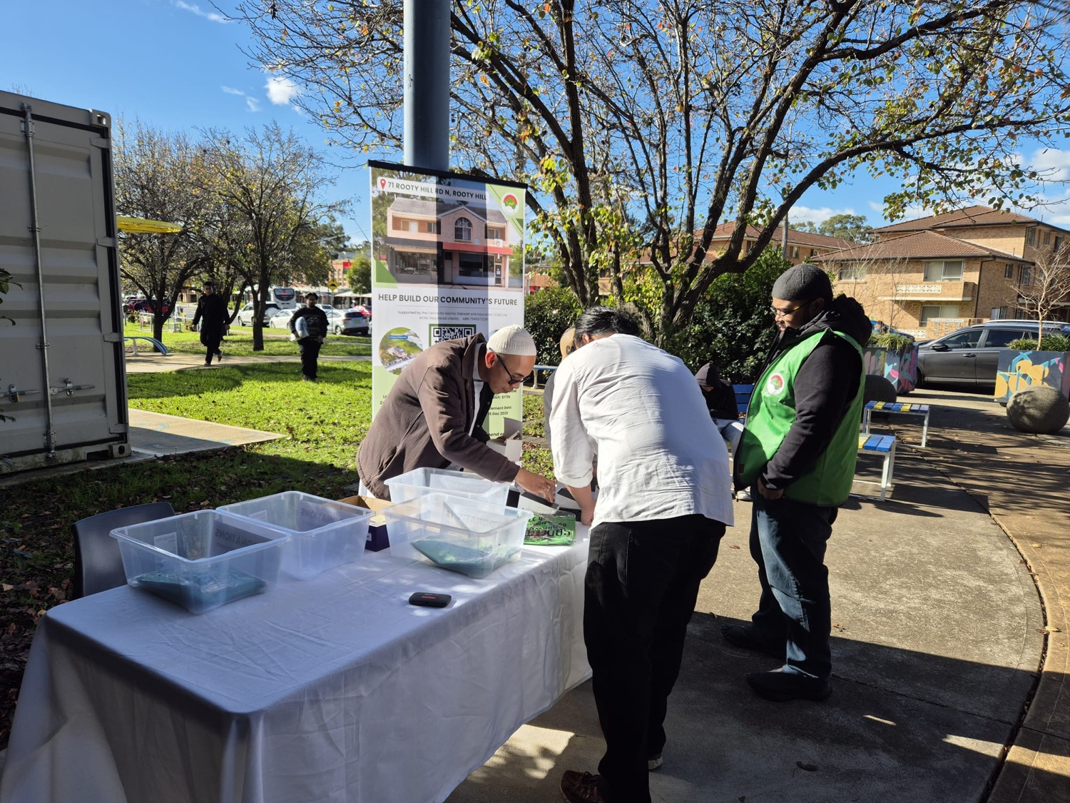 Worshippers giving at the collection table during the Jumu'ah fundraiser