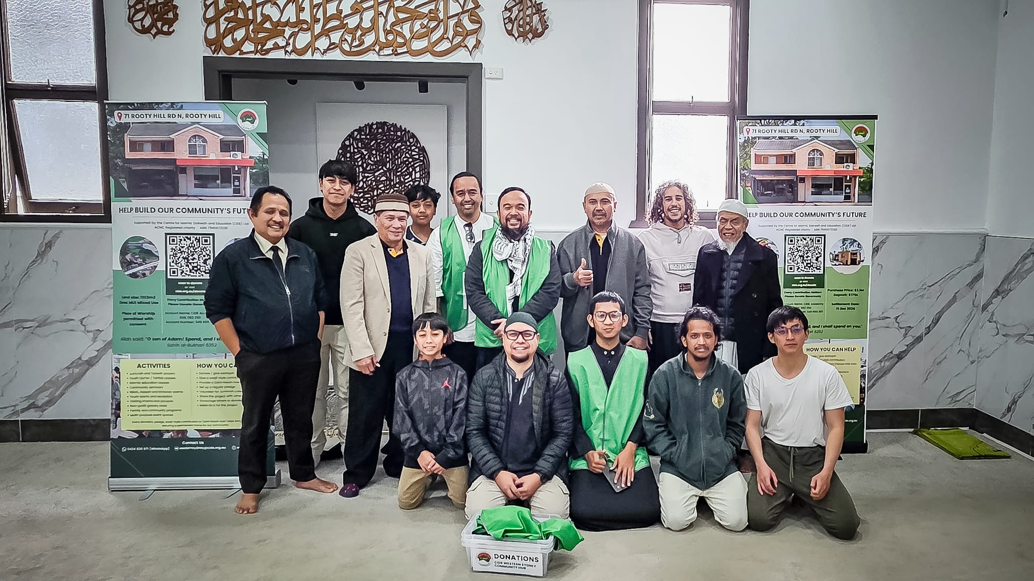 The CIDE Western Sydney team and volunteers at Al-Hijrah Mosque, Tempe with the campaign banners