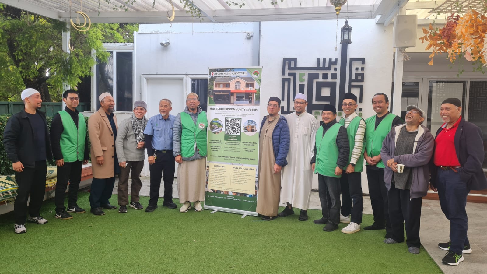 The CIDE Western Sydney team and volunteers at IQRO Masjid with the campaign banner